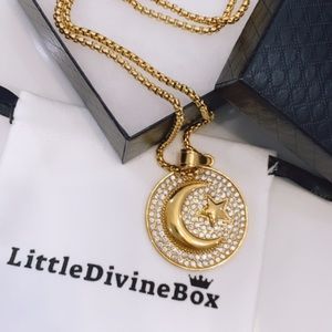 Gold crystal round star moon necklace.